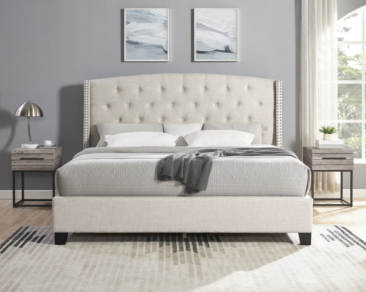 Beige upholstered bed with tufted headboard in a bedroom setting.