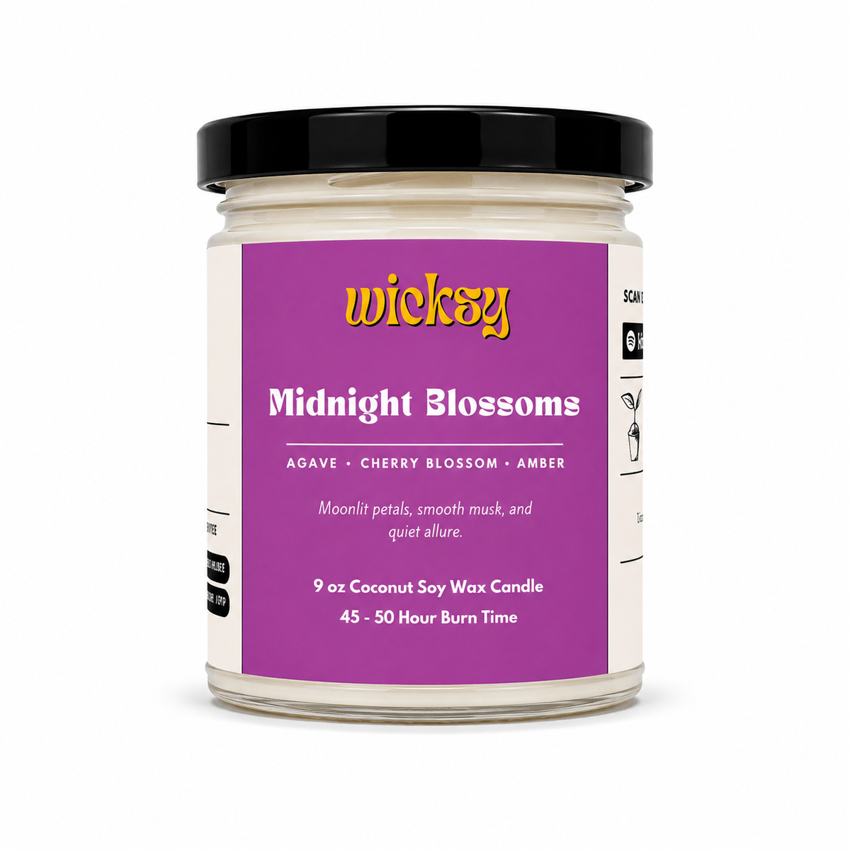 A jar candle labeled 'wicky Midnight Blossoms' with a purple label and black lid, photographed on a clean white background.