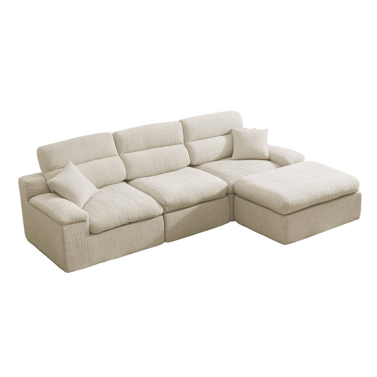 An L-shaped sectional sofa upholstered in textured cream fabric, featuring a chaise lounge on the right side and two matching throw pillows, shown on a plain white background.